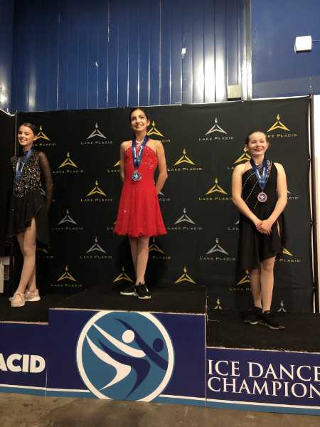 cherri being awarded first at nationals for ice skating