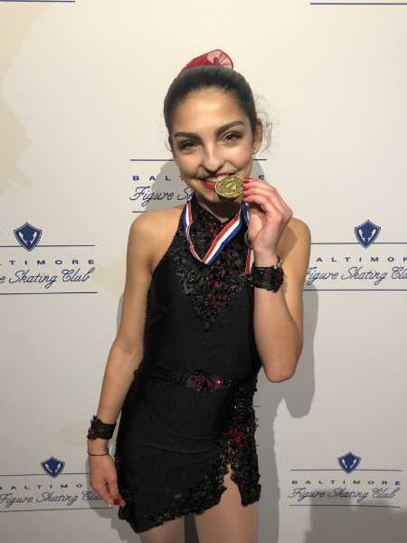 cheri with gold medal for figure skating